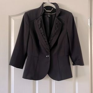 Beautiful petite blazer made by White House. Black market size 4